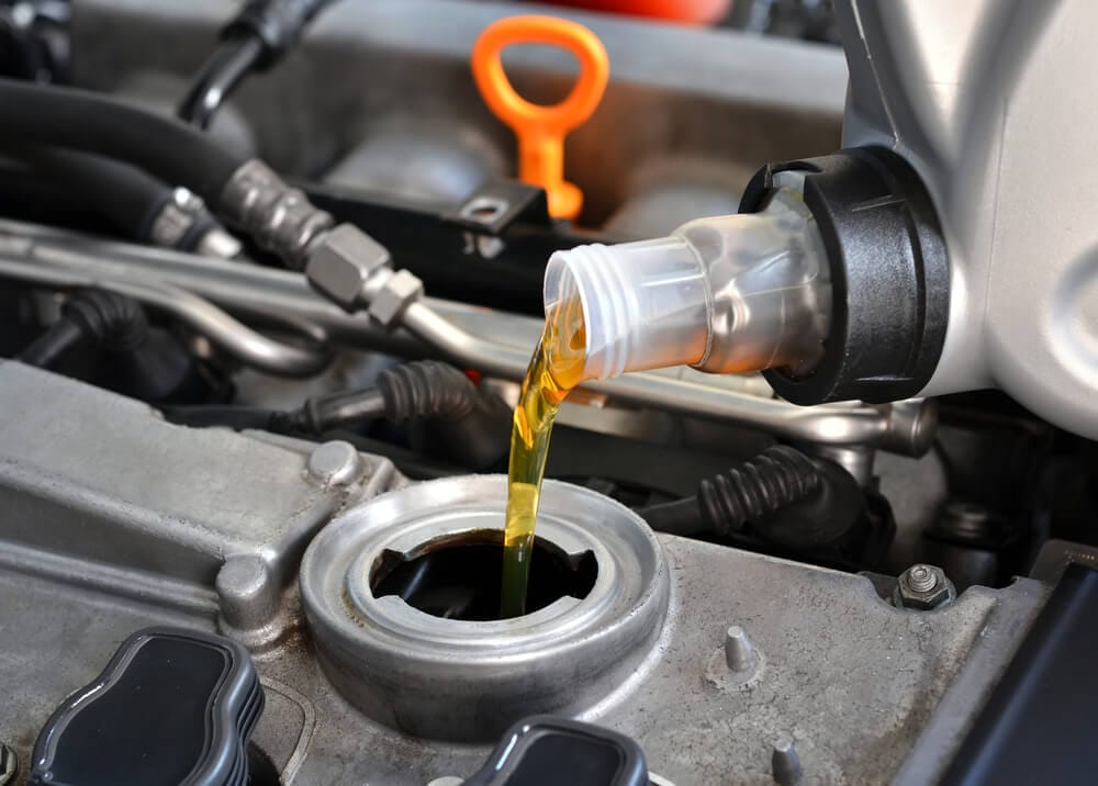 Changing car engine oil & What does a usual car service involve